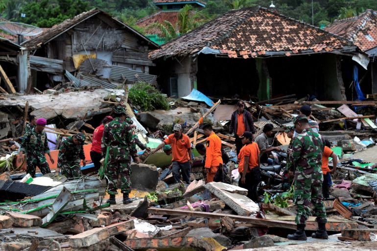 Rescue team members search for victims among debris after a tsunami hit at Rajabasa district in South Lampung, Indonesia, December 23, 2018 in this photo taken by Antara Foto. Antara Foto/Ardiansyah/ via REUTERS ATTENTION EDITORS - THIS IMAGE WAS PROVIDED BY A THIRD PARTY. MANDATORY CREDIT. INDONESIA OUT.