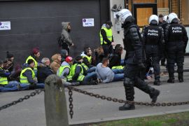 Yellow vests' protest in Brussels- - BRUSSELS, BELGIUM - DECEMBER 08: Police officers take yellow vests (gilets jaunes) into custody during a protest in Brussels, Belgium on December 08, 2018.