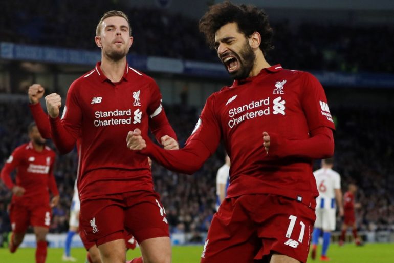Soccer Football - Premier League - Brighton & Hove Albion v Liverpool - The American Express Community Stadium, Brighton, Britain - January 12, 2019 Liverpool's Mohamed Salah celebrates scoring their first goal with Jordan Henderson Action Images via Reuters/Paul Childs EDITORIAL USE ONLY. No use with unauthorized audio, video, data, fixture lists, club/league logos or