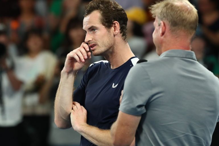 MELBOURNE, AUSTRALIA - JANUARY 14: Andy Murray of Great Britain watches a tribute video after losing his first round match against Roberto Bautista Agut of Spain during day one of the 2019 Australian Open at Melbourne Park on January 14, 2019 in Melbourne, Australia. (Photo by Cameron Spencer/Getty Images)