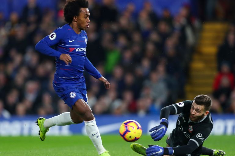LONDON, ENGLAND - JANUARY 02: Willian of Chelsea in action against Angus Gunn of Southampton during the Premier League match between Chelsea FC and Southampton FC at Stamford Bridge on January 2, 2019 in London, United Kingdom. (Photo by Clive Rose/Getty Images)