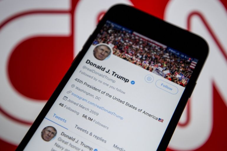 US President Donald Trump and CNN International logo- - ANKARA, TURKEY - DECEMBER 9: Donald Trump's Twitter timeline is seen on a smartphone against a backdrop with the CNN TV channel logo, in Ankara, Turkey on December 9, 2018.