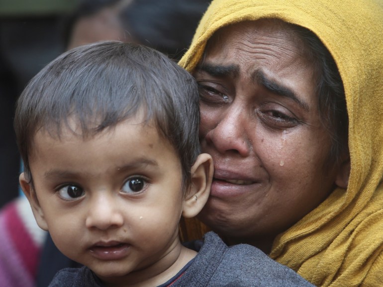 A Rohingya Muslim woman cries as she holds her daughter after they were detained by Border Security Force (BSF) soldiers while crossing the India-Bangladesh border from Bangladesh, at Raimura village on the outskirts of Agartala, January 22, 2019. REUTERS/Jayanta Dey