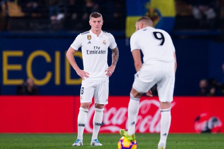 VILLAREAL, SPAIN - JANUARY 03: Toni Kroos and Karim Benzema of Real Madrid CF react after the opening goal made by Santi Cazorla of Villarreal CF during the La Liga match between Villarreal CF and Real Madrid CF at Estadio de la Ceramica on January 03, 2019 in Villarreal, Spain. (Photo by Alex Caparros/Getty Images)
