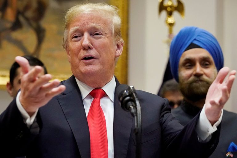 U.S. President Donald Trump participates in the Diwali ceremonial lighting of the Diya as India’s Ambassador to the U.S. Navtej Sarna (R) looks on in the Roosevelt Room of the White House in Washington, U.S. November 13, 2018. REUTERS/Jonathan Ernst