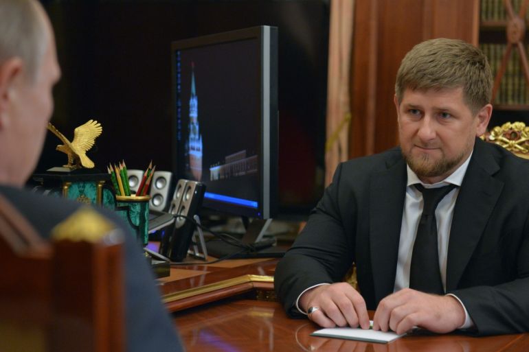 Russian President Vladimir Putin (L) speaks with the Head of the Chechen Republic Ramzan Kadyrov