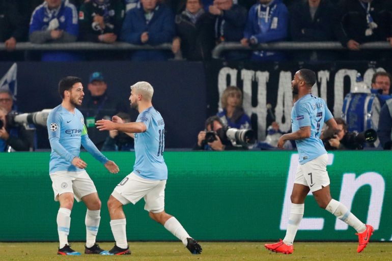 Soccer Football - Champions League - Round of 16 First Leg - Schalke 04 v Manchester City - Veltins-Arena, Gelsenkirchen, Germany - February 20, 2019 Manchester City's Sergio Aguero celebrates scoring their first goal with David Silva and Raheem Sterling Action Images via Reuters/Matthew Childs