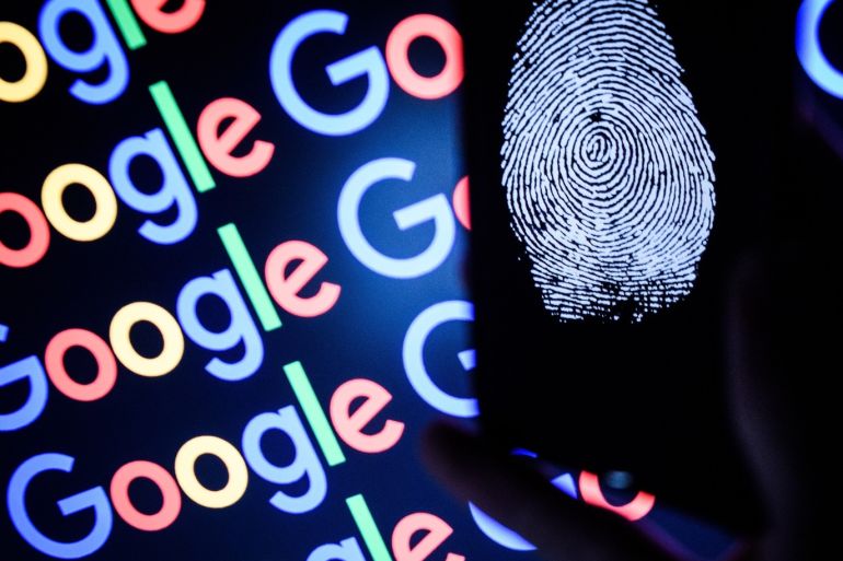 LONDON, ENGLAND - AUGUST 09: In this photo illustration, A thumbprint is displayed on a mobile phone while the Google logo is displayed on a computer monitor on August 09, 2017 in London, England. Founded in 1995 by Sergey Brin and Larry Page, Google now makes hundreds of products used by billions of people across the globe, from YouTube and Android to Smartbox and Google Search. (Photo by Leon Neal/Getty Images)