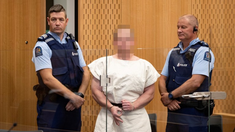 Brenton Tarrant, charged for murder, making a sign to the camera during his appearance in the Christchurch District Court, New Zealand March 16, 2019. Mark Mitchell/New Zealand Herald/Pool via REUTERS. ATTENTION EDITORS - PICTURE PIXELATED AT SOURCE. SUSPECT FACE MUST BE PIXELATED. ONLY HIS FACE. TPX IMAGES OF THE DAY