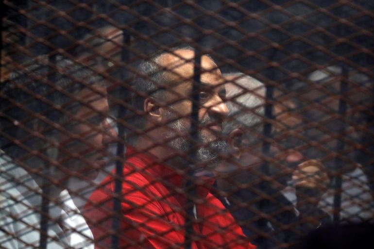 Muslim Brotherhood's senior member Mohamed El-Beltagy sits behind the bars during a court session in Cairo, Egypt, December 2, 2018. REUTERS/Amr Abdallah Dalsh