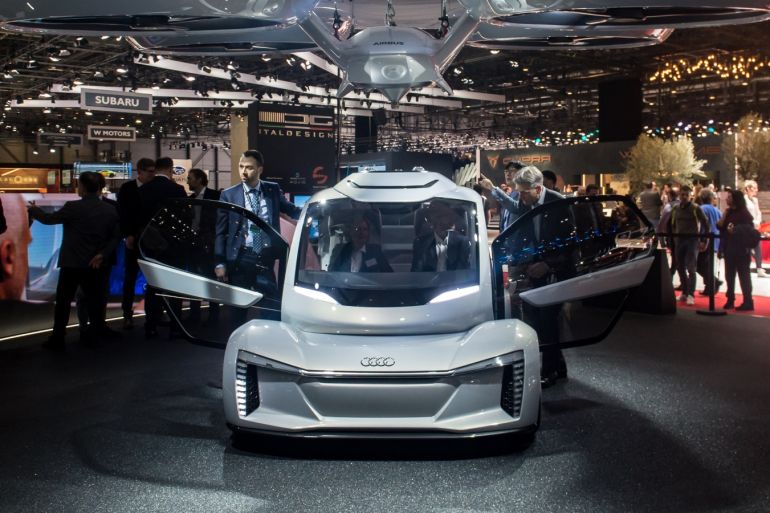 GENEVA, SWITZERLAND - MARCH 06: The 'Pop.up next' concept flying car, a hybrid vehicle that blends a self-driving car and passenger drone by Audi, italdesign and Airbus is seen at the 88th Geneva International Motor Show on March 6, 2018 in Geneva, Switzerland. Global automakers are converging on the show as many seek to roll out viable, mass-production alternatives to the traditional combustion engine, especially in the form of electric cars. The Geneva auto show is