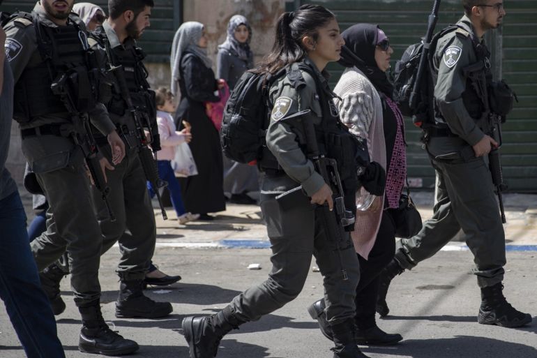 Israeli police's intervention to Mother’s Day celebration- - JERUSALEM - MARCH 21: Israeli security forces take a Palestinian woman into custody during a fair organized by Jerusalem Girls Association to mark