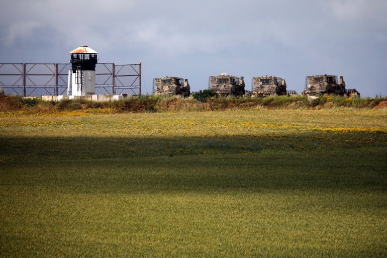 Israeli military armored bulldozers are seen in an open area near the border with Gaza, in southern Israel March 25, 2019. REUTERS/Amir Cohen