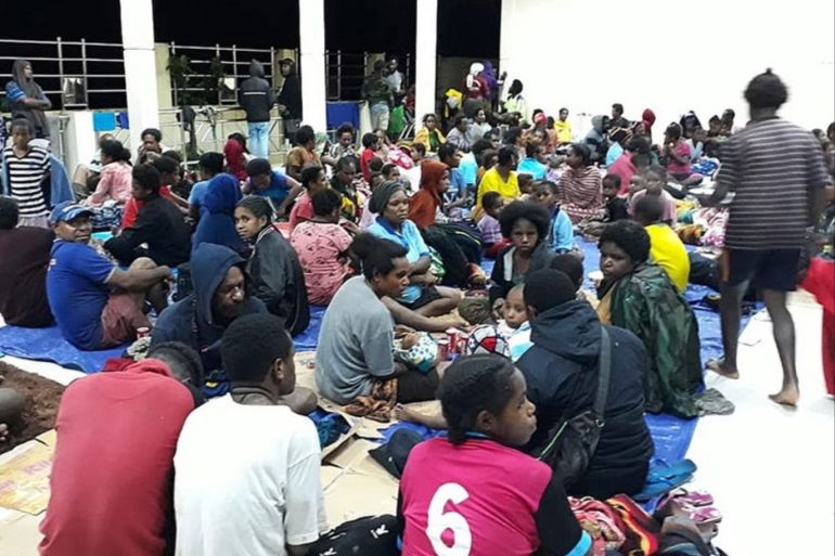 epa07443968 A handout made available by Indonesia's National Disaster Management Agency (BNPB) shows residents gathering at a temporary shelter as flash flood affect the area in Sentani, near Jayapura, Papua province, Indonesia, 17 March 2019. At least 42 people were killed and 21 injured as a flash floods hit Sentani, according to Sutopo Purwo Nugroho, a spokesman for the National Disaster Management Agency. EPA-EFE/BNPB / HANDOUT BEST QUALITY AVAILABLE HANDOUT EDITORIAL USE ONLY/NO SALES