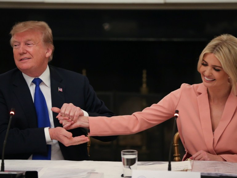 U.S. President Donald Trump grabs the hand of White House senior advisor and his daughter Ivanka Trump as they participate in an American Workforce Policy Advisory Board meeting in the White House State Dining Room in Washington, U.S., March 6, 2019. REUTERS/Leah Millis?