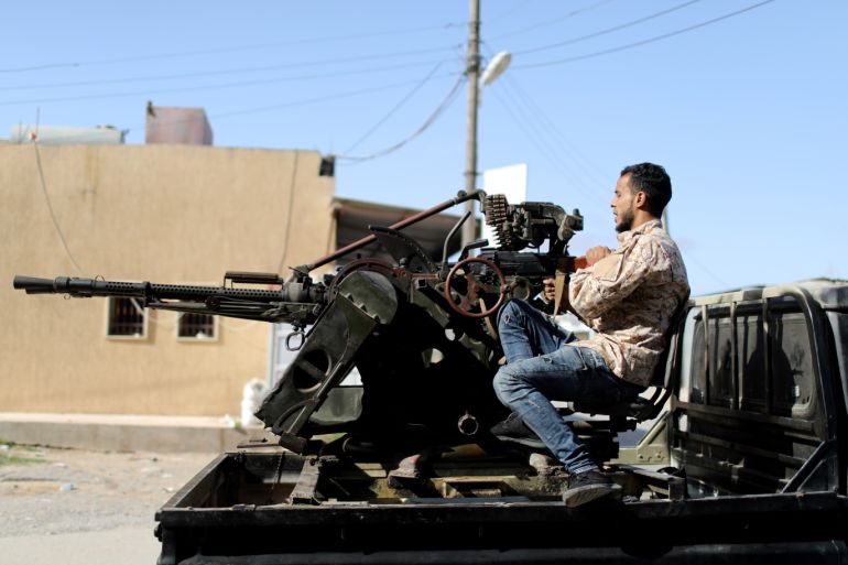 A member of Libyan internationally recognised pro-government forces prepares his weapon in Ain Zara, south of Tripoli, Libya April 11, 2019. REUTERS/Ahmed Jadallah
