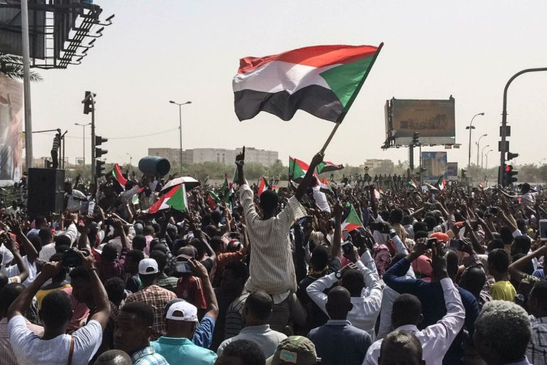 Protests in Sudan- - KHARTOUM, SUDAN - APRIL 11 : Sudanese people march towards military headquarters after the Sudanese Professionals Association's (SPA) call in Khartoum, Sudan on April 11, 2019. Hundreds of Sudanese protesters on Wednesday staged a sit-in outside army headquarters in the capital for the fifth day in a row amid continued calls for President Omar al-Bashir to step down.