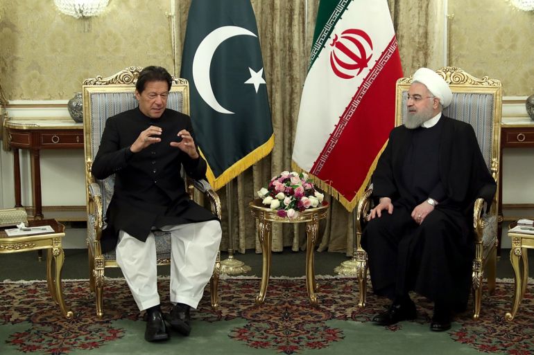 epa07521057 A handout photo made available by the presidential office shows Iranian President Hassan Rouhani (R) talks to Pakistani Prime Minister Imran Khan (L) during a welcome ceremony in Tehran, Iran, 22 April 2019. The media reported that Imran Khan is in Tehran to meet the Iranian officials. EPA-EFE/IRANIAN PRESIDENTIAL OFFICE / HANDOUT HANDOUT EDITORIAL USE ONLY/NO SALES