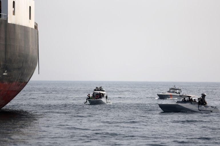 UAE Navy boats next to Al Marzoqah Saudi Arabia tanker are seen off the Port of Fujairah, UAE May 13, 2019.REUTERS/Satish Kumar