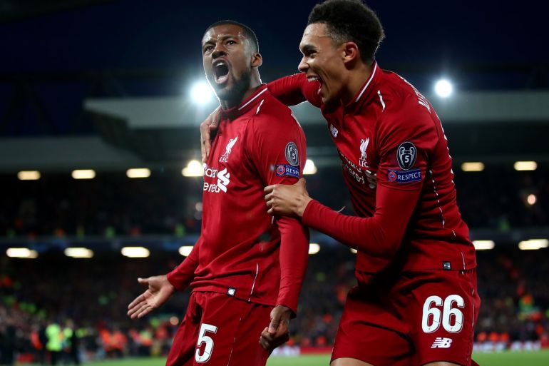 LIVERPOOL, ENGLAND - MAY 07: Georginio Wijnaldum of Liverpool celebrates after scoring his team's third goal with Trent Alexander-Arnold during the UEFA Champions League Semi Final second leg match between Liverpool and Barcelona at Anfield on May 07, 2019 in Liverpool, England. (Photo by Clive Brunskill/Getty Images)