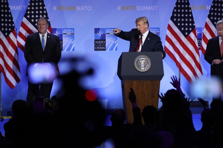 BRUSSELS, BELGIUM - JULY 12: U.S. President Donald Trump, flanked by U.S. Secretary of State Mike Pompeo (L) and National Security Advisor John Bolton, speaks to the media at a press conference on the second day of the 2018 NATO Summit on July 12, 2018 in Brussels, Belgium. Leaders from NATO member and partner states are meeting for a two-day summit, which is being overshadowed by strong demands by U.S. President Trump for most NATO member countries to spend more on de