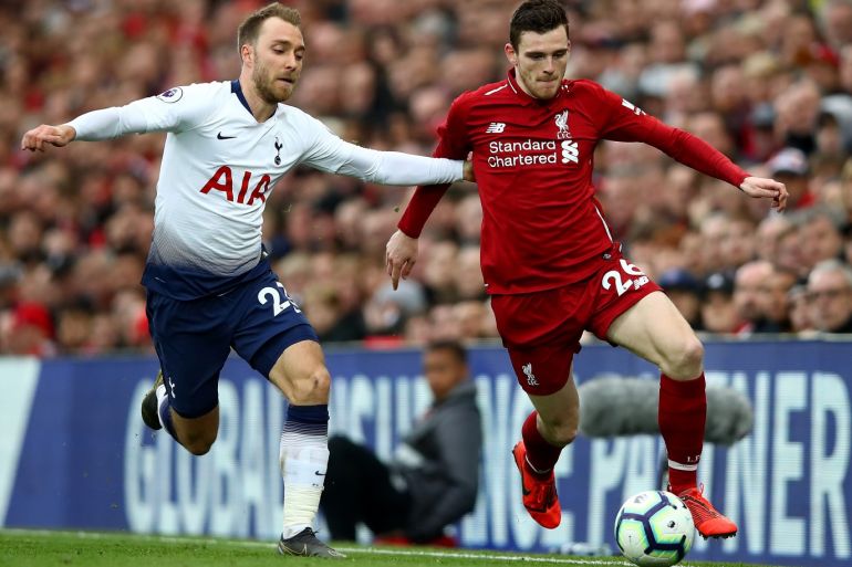 LIVERPOOL, ENGLAND - MARCH 31: Christian Eriksen of Tottenham Hotspur tackles Andrew Robertson of Liverpool during the Premier League match between Liverpool FC and Tottenham Hotspur at Anfield on March 31, 2019 in Liverpool, United Kingdom. (Photo by Clive Brunskill/Getty Images)