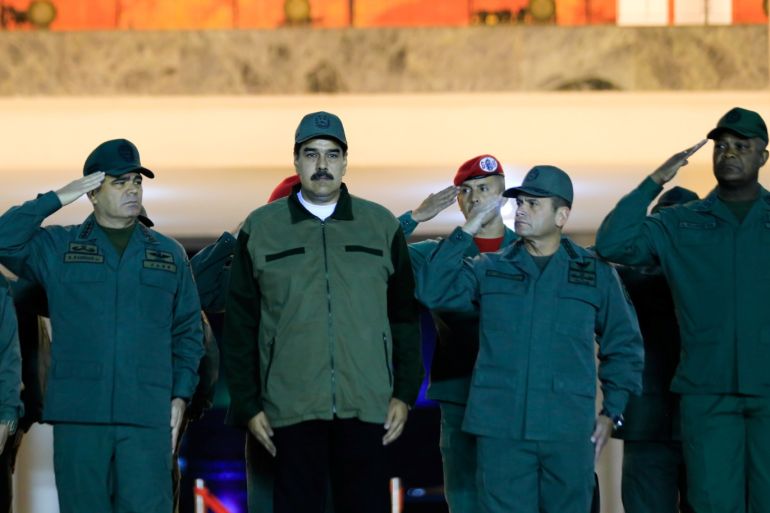 Venezuela's President Nicolas Maduro stands next to Venezuela's Defense Minister Vladimir Padrino Lopez and Remigio Ceballos, Strategic Operational Commander of the Bolivarian National Armed Forces, during a ceremony at a military base in Caracas, Venezuela May 2, 2019. Miraflores Palace/Handout via REUTERS ATTENTION EDITORS - THIS PICTURE WAS PROVIDED BY A THIRD PARTY.