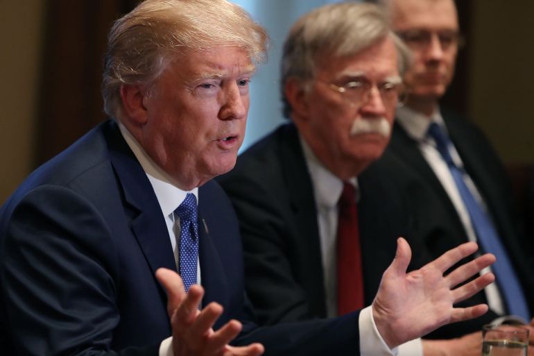 WASHINGTON, DC - APRIL 09: U.S. President Donald Trump is flanked by National Security Advisor John Bolton as he speaks about the FBI raid at his lawyer Michael Cohen's office, while receiving a briefing from senior military leaders regarding Syria, in the Cabinet Room, on April 9, 2018 in Washington, DC. The FBI raided the office of Michael Cohen on Monday as part of the ongoing investigation into the president's administration. Mark Wilson/Getty Images/AFP== FOR N