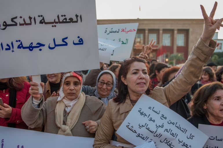 Protest on 'violence against women' in Rabat- - RABAT, MOROCCO - MARCH 08: Women hold banners during a protest on 'violence against women' regarding the International Women's Day in front of Parliament Building in Rabat, Morocco on March 08, 2018.