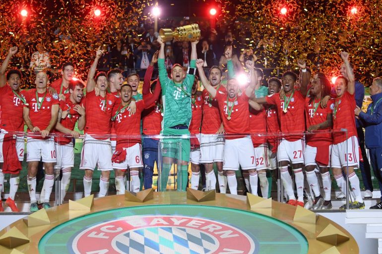 BERLIN, GERMANY - MAY 25: Captain Manuel Neuer of Bayern Munich lifts the trophy in celebration after the DFB Cup final between RB Leipzig and Bayern Muenchen at Olympiastadion on May 25, 2019 in Berlin, Germany. (Photo by Matthias Hangst/Bongarts/Getty Images)