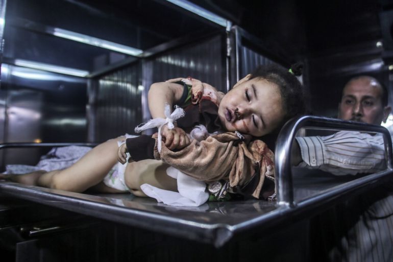 epa07547396 The body of Seba Arrar, a Palestinian girl, lies at the morgue of al-Shifa hospital in Gaza City, 04 May 2019. The baby and her mother were allegedly killed by an Israeli strike in the Gaza Strip on the same day. Reports state five Palestinians were killed, including three in Israeli airstrikes in the Gaza Strip. The Israeli army said almost 100 rockets were fired from the strip. EPA-EFE/HAITHAM IMAD ATTENTION: GRAPHIC CONTENT