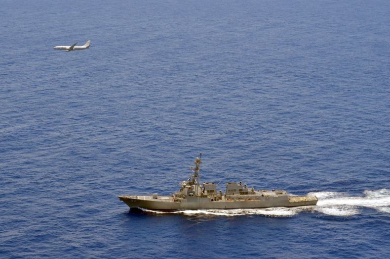 A P-8A Poseidon attached to Maritime Patrol Squadron (VP) 8 flies over the guided-missile destroyer USS Momsen (DDG 92) in the South China Sea June 29, 2016. Picture taken June 29, 2016. To match Special Report CHINA-ARMY/NUCLEAR U.S. Navy photo by Naval Aircrewman 2nd Class Daniel Rodriguez/Handout via REUTERS ATTENTION EDITORS - THIS IMAGE HAS BEEN SUPPLIED BY A THIRD PARTY.