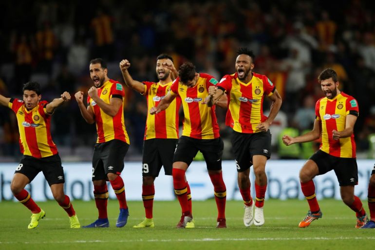 Soccer Football - Club World Cup - Match for fifth place - Esperance Sportive de Tunis v Guadalajara - Hazza Bin Zayed Stadium, Al Ain City, United Arab Emirates - December 18, 2018 Esperance Sportive de Tunis players react during the penalty shoot-out REUTERS/Andrew Boyers