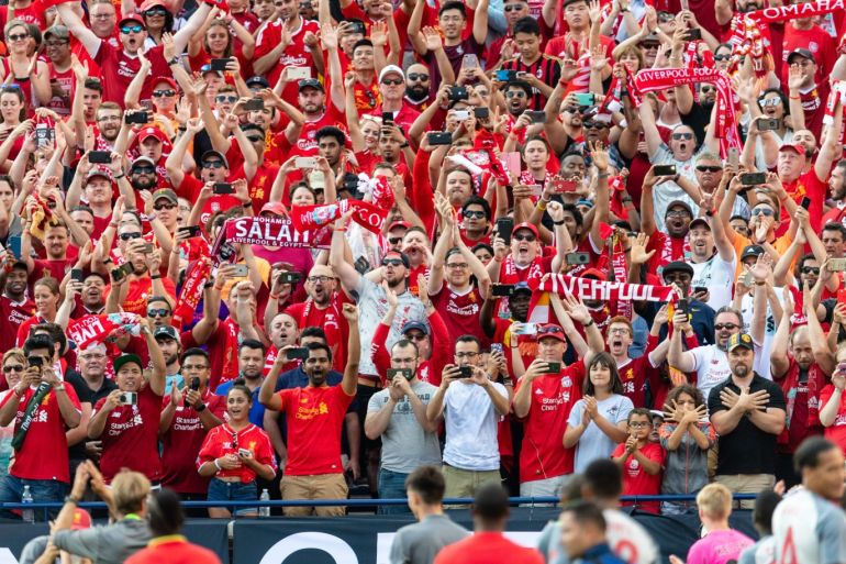 ANN ARBOR, MI - JULY 28: Liverpool fans celebrate as their team tours the stadium after defeating Manchester United during the International Champions Cup 2018 at Michigan Stadium on July 28, 2018 in Ann Arbor, Michigan. Liverpool defeated Manchester United 4-1. Jason Miller/Getty Images/AFP== FOR NEWSPAPERS, INTERNET, TELCOS & TELEVISION USE ONLY ==