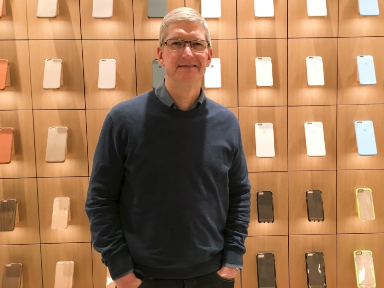 Apple Chief Executive Officer Tim Cook poses for a portrait during a event for students to learn to write computer code at the Apple store in the Manhattan borough of New York December 9, 2015. REUTERS/Carlo Allegri