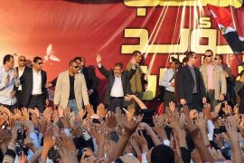 Morsi waves to his supporters next to the presidential palace in cairo 23 november 2012