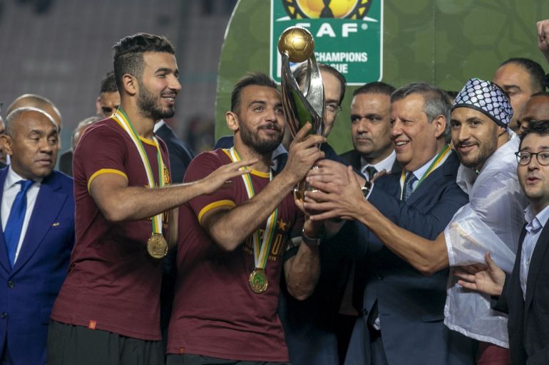 Esperance v Wydad Casablanca: CAF Champions league- - RADES, TUNIS - JUNE 1: Football players of Esperance receive trophy from Tunisian Prime Minister Youssef Chahed as Esperance won the championship title after football players of Wydad Casablanca abandoned the field during the CAF (Confederation of African Football) Champions league final match between Esperance and Wydad Casablanca at Stade Olympique de Rades in Rades, Tunisia on June 1, 2019.