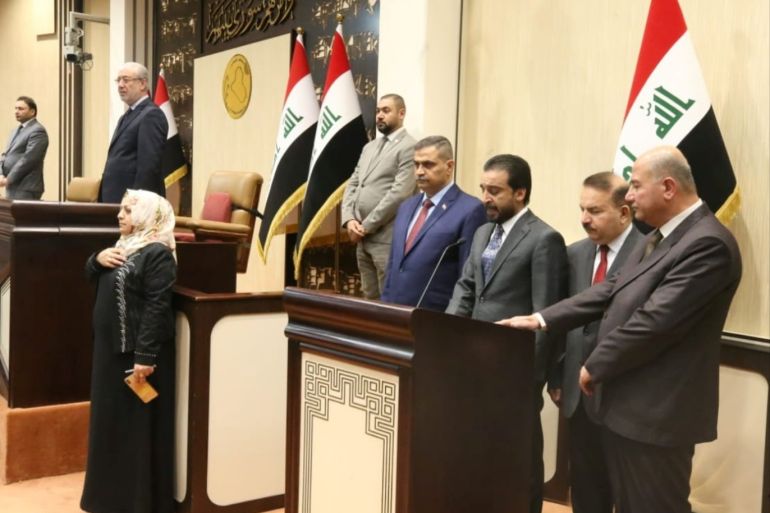 The speaker of Iraq's parliament Mohammed al-Halbousi stands with the newly pointed ministers: Defence Minister Najah al-Shammari, Interior Minister Yaseen al-Yasiri, and Minister of Justice Faruq Ameen during a swearing-in ceremony at the parliament headquarters in Baghdad, Iraq June 24, 2019. Iraqi parliament media office/Handout via REUTERS ATTENTION EDITORS - THIS PICTURE WAS PROVIDED BY A THIRD PARTY.