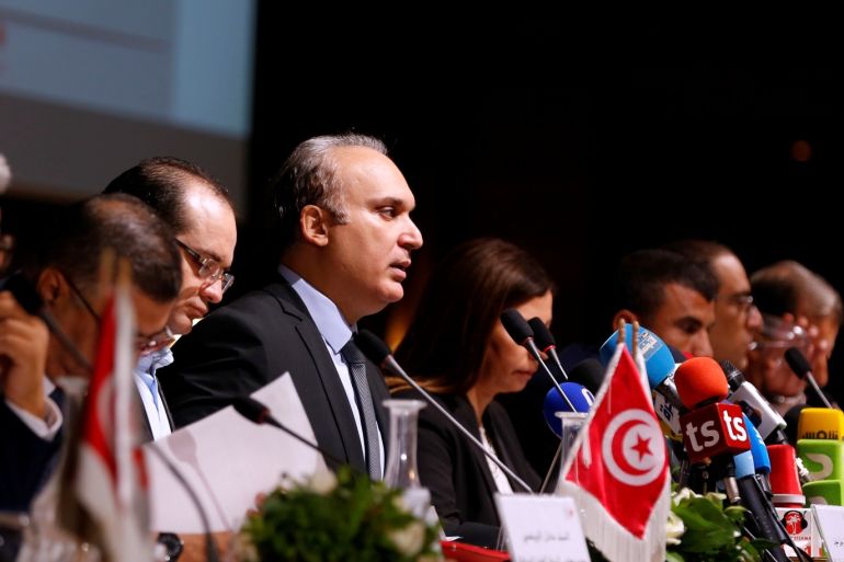 President of Tunisia's independent electoral committee (ISIE) Nabil Baffoun (C) attends a news conference in Tunis, Tunisia July 30, 2019. Picture taken July 30, 2019. REUTERS/Zoubeir Souissi