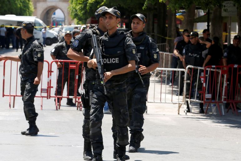 Police officers stand guard near the site of a suicide bombing attack in downtown Tunis, Tunisia June 27, 2019. REUTERS/Zoubeir Souissi