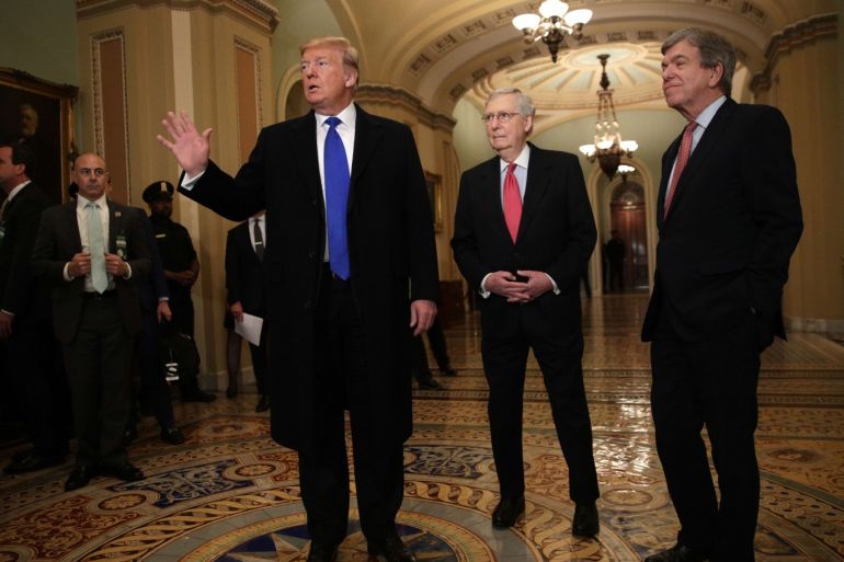 WASHINGTON, DC - MARCH 26: U.S. President Donald Trump (L) speaks to members of the media as Senate Majority Leader Sen. Mitch McConnell (R-KY) (2nd L), and Sen. Roy Blunt (R-MO) (R) look on after he arrived at a Senate Republican weekly policy luncheon at the U.S. Capitol March 26, 2019 in Washington, DC. Congressional top Democrats have demanded Attorney General William Barr to release special counsel Robert Muellers investigation report for the alleged Russian interf
