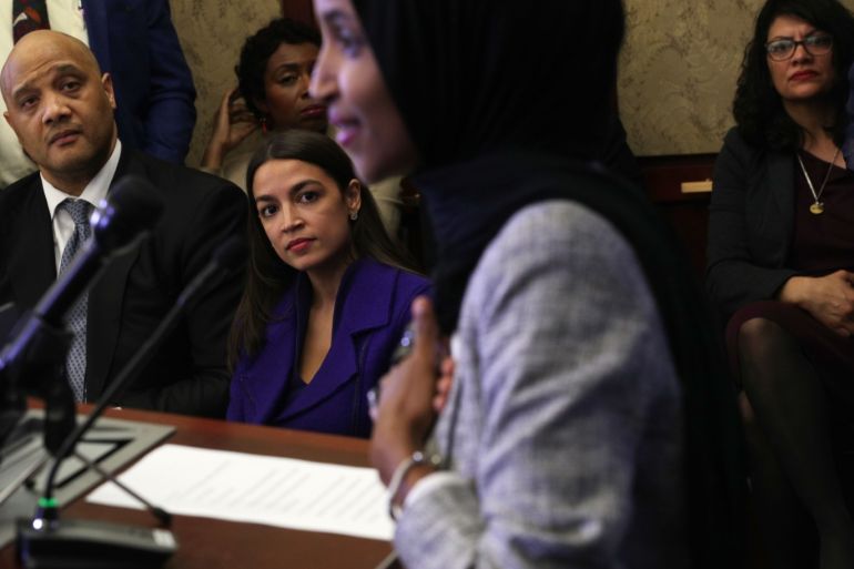 WASHINGTON, DC - MAY 20: (L-R) U.S. Reps. Andre Carson (D-IN), Alexandria Ocasio-Cortez (D-NY) and Rashida Tlaib (D-MI) listen to Rep. Ilhan Omar (D-MN) speak during a congressional Iftar event at the U.S. Capitol May 20, 2019 in Washington, DC. Muslims around the world are observing the holy month with prayers, fasting from dawn to sunset and nightly feasts. Alex Wong/Getty Images/AFP== FOR NEWSPAPERS, INTERNET, TELCOS & TELEVISION USE ONLY ==