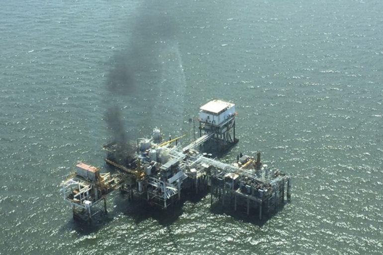 U.S. Coast Guard aerial photo shows a fire on board an oil production platform in Breton Sound Block 21 located about 20 miles (32 km) east of the boot tip of Louisiana, in the Gulf of Mexico May 22, 2015. All 28 workers aboard were taken from the platform onto a nearby supply vessel and taken ashore. No one was hurt, according to the U.S. Coast Guard. REUTERS/Liam Mcdonnell/U.S. Coast Guard/Handout via ReutersATTENTION EDITORS - THIS PICTURE WAS PROVIDED BY A THIRD PARTY. REUTERS IS UNABLE TO INDEPENDENTLY VERIFY THE AUTHENTICITY, CONTENT, LOCATION OR DATE OF THIS IMAGE. THIS PICTURE WAS PROCESSED BY REUTERS TO ENHANCE QUALITY. EDITORIAL USE ONLY. NOT FOR SALE FOR MARKETING OR ADVERTISING CAMPAIGNS.