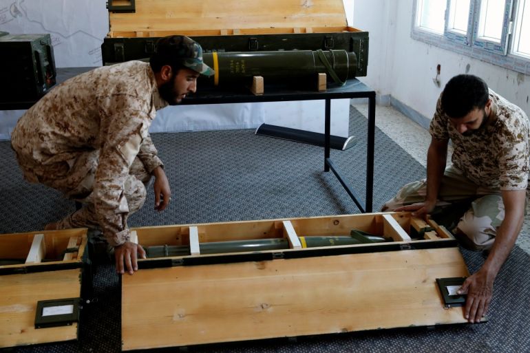 Members of forces allied to Libya's internationally recognized government check the weapons, which were confiscated from eastern forces led by Khalifa Haftar in Gharyan, displayed for media in Tripoli, Libya June 29, 2019. REUTERS/Ismail Zitouny