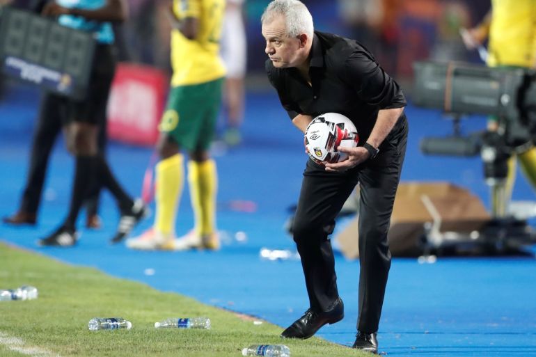 Soccer Football - Africa Cup of Nations 2019 - Round of 16 - Egypt v South Africa - Cairo International Stadium, Cairo, Egypt - July 6, 2019 Egypt coach Javier Aguirre with the match ball REUTERS/Amr Abdallah Dalsh