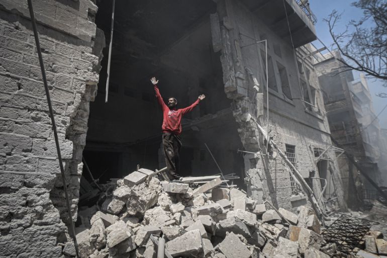 Regime attacks kill 6 in Syria’s de-escalation zone- - IDLIB, SYRIA - JULY 28: A man reacts on the rubble after Assad Regime warplanes carried out airstrikes on the town of Arihah in Idlib province, Syria on July 28, 2019. At least six civilians were killed and 18 others injured in regime attacks in de-escalation zone in northwestern Syria.