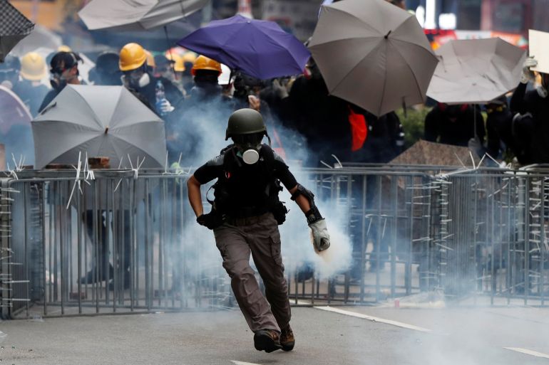 An anti-extradition bill protester holds a tear gas canister during a demonstration in Sham Shui Po neighbourhood in Hong Kong, China, August 11, 2019. REUTERS/Issei Kato