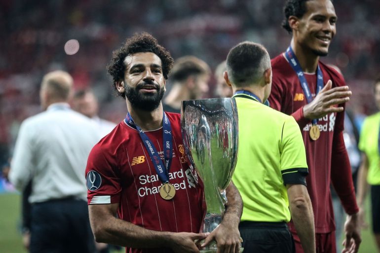 Liverpool v Chelsea: UEFA Super Cup- - ISTANBUL, TURKEY - AUGUST 15: Mohamed Salah holds the trophy as Liverpool celebrate winning the 2019 UEFA Super Cup final by beating Chelsea 5-4 on penalties at Vodafone Park in Istanbul, Turkey on August 15, 2019.