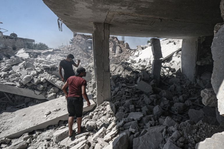 Airstrikes continue to hit Idlib- - IDLIB, SYRIA - AUGUST 26: Syrians inspect the debris of buildings after Russian airstrike hit Idlib, de-escalation zone, Syria on August 26, 2019. The airstrike killed 6 civilians, injuring 12.