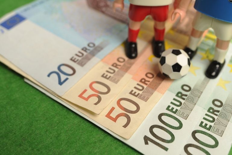 HAMBURG, GERMANY - FEBRUARY 06: This photo illustration shows Euro bank notes and a table soccer game on February 6, 2013 in Hamburg, Germany. Europol have uncovered evidence that hundreds of football matches were subject to corruption leaving more than 400 officials and players under suspicion of involvement. (Photo by Stuart Franklin/Bongarts/Getty Images)